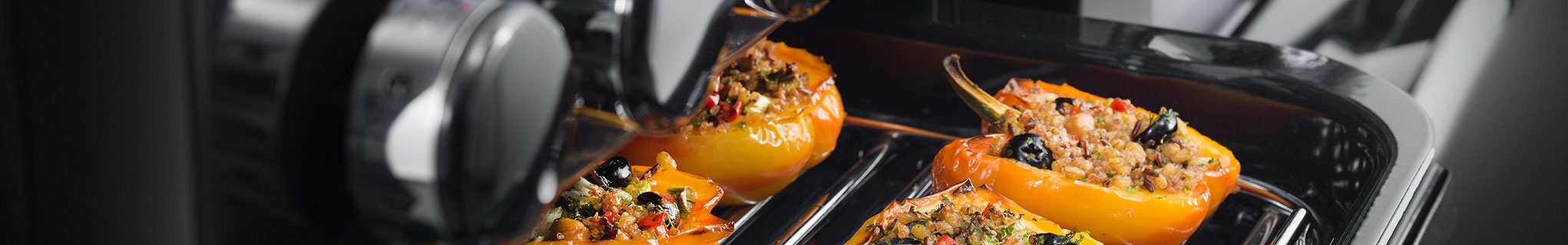 AGA Masterchef Deluxe Glide-Out Grill with peppers cooking