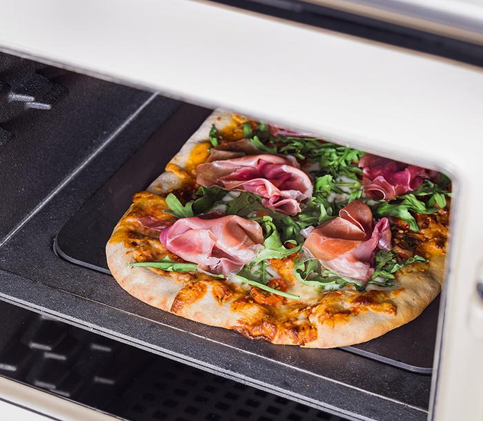 Pizza cooking in the cast-iron AGA ovens