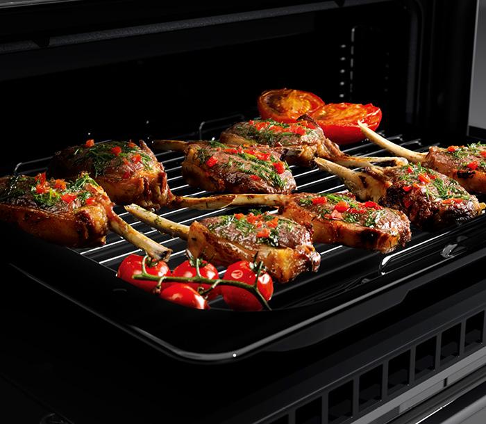 Falcon Infusion deluxe flexi-grill with pork chops and tomatoes